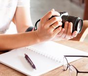Woman with camera in the hands