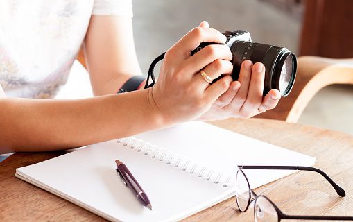 Woman with camera in the hands