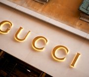 "Verona, Italy - June 15, 2012: Gucci store sign located in Via Mazzini, the Veronese shopping street par excellence, with shops and boutiques of the most prestigious Italian and international fashion brands."