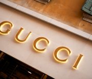 "Verona, Italy - June 15, 2012:  Gucci store sign located in Via Mazzini, the Veronese shopping street par excellence, with shops and boutiques of the most prestigious Italian and international fashion brands."
